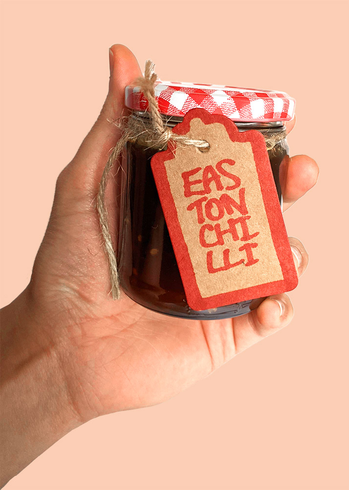 Hand holding jar of Easton Chilli jam
